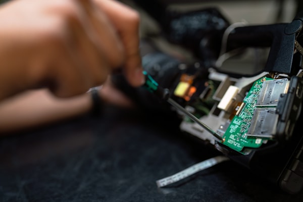 Engineer working on industrial control electronics
